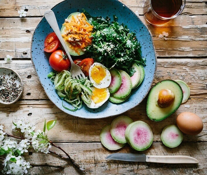 Bowl of egg salad with a range of other vegetables