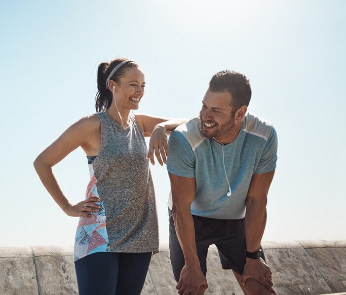 Man and woman resting after a run