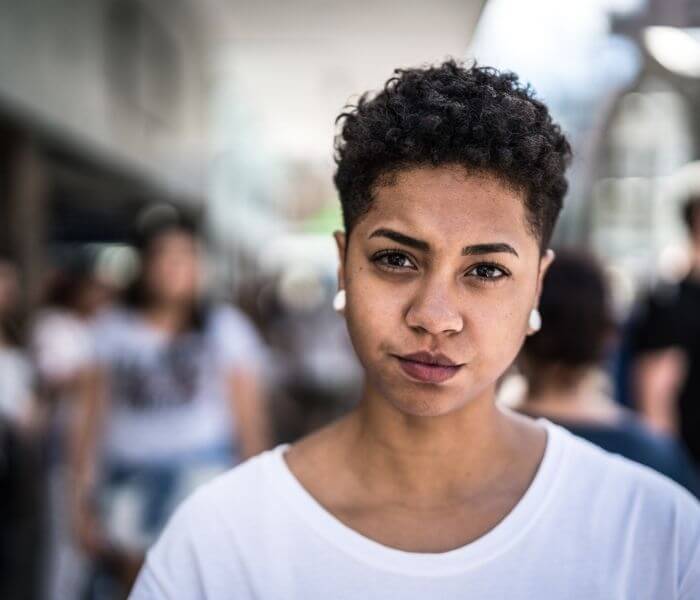 Woman in white t-shirt in a street