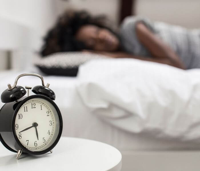 Alarm clock on a bedside table