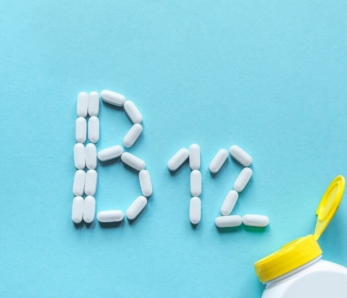 Vitamins arranged in the writing of "b12"