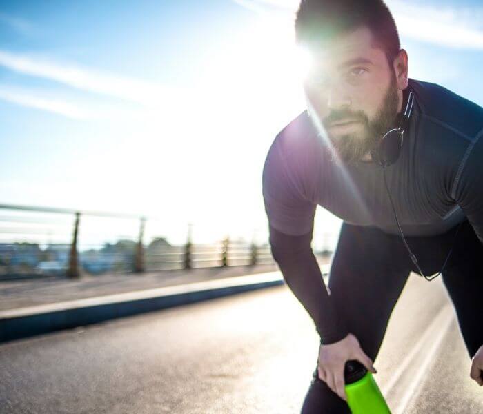 Man taking a break from running