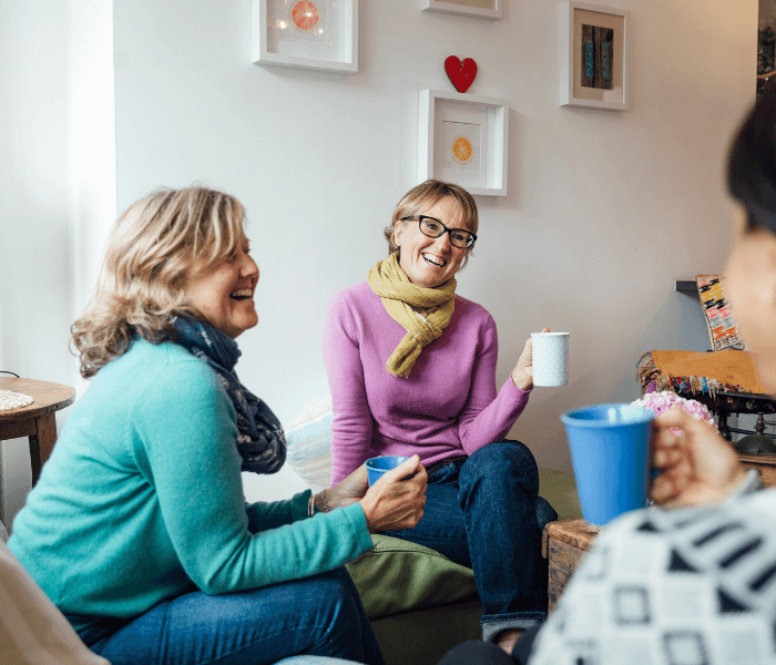 Women smile having a cup of tea