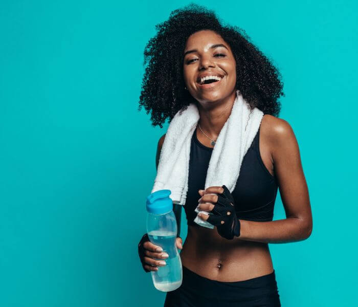 Happy woman resting after workout stock photo