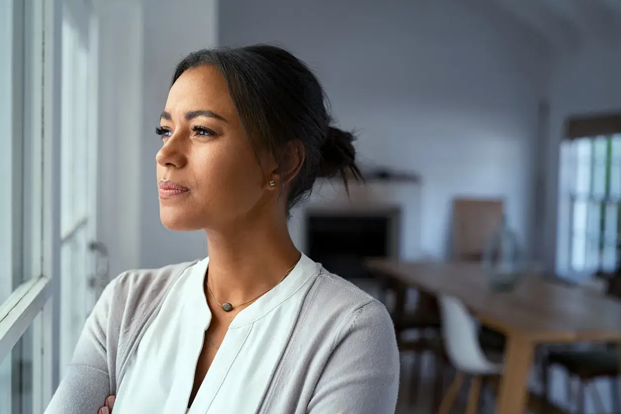 Woman in her 30s looking pensive