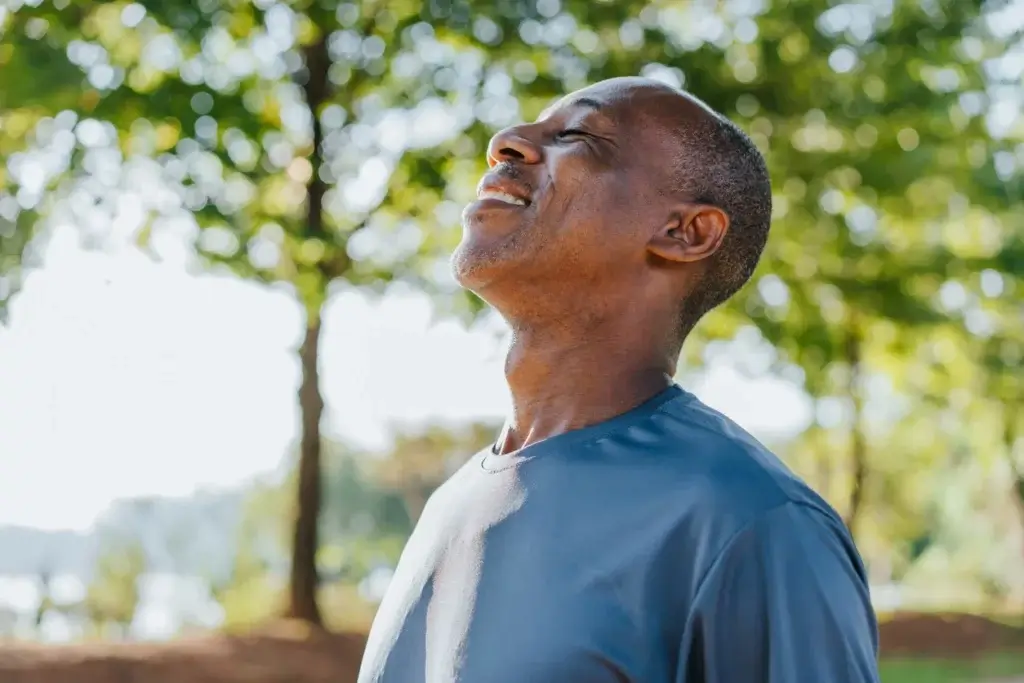 Middle aged man smiling due to good healthspan