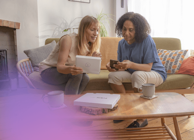 Two women looking at their perimenopause test results